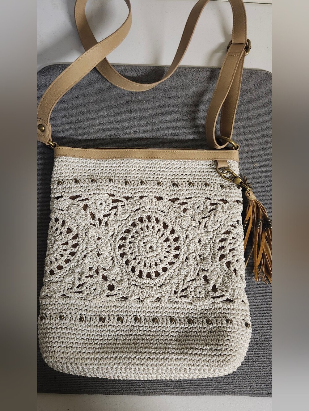 The Sak Cream Crochet Crossbody with Tan Strap and Tassel